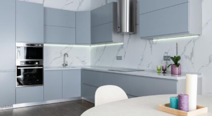 Stylish modern kitchen featuring clean lines, marble accents, and sleek appliances, perfect for contemporary homes.