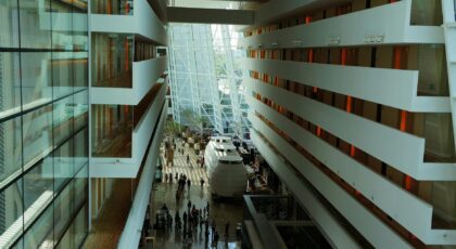 Elegant interior view of a modern hotel with glass facade in Singapore's Marina Bay Sands.