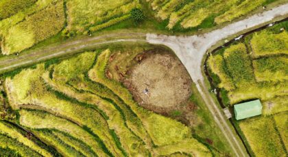 Discover the lush and vibrant rice terraces of Ubud, Bali, from an aerial perspective.