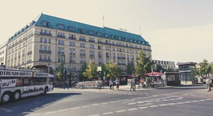 A vibrant day view of the famous Hotel Adlon in Berlin, with bustling city life.
