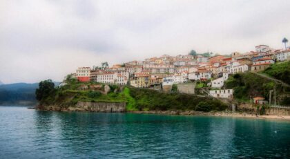 Picturesque coastal village in Asturias, Spain, with colorful houses by the sea.
