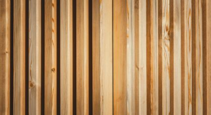 A detailed view of a wooden panel with natural texture and pattern, showcasing the beauty of wood grain.