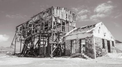 Desolate abandoned buildings in Pedra Lume, Sal, Cabo Verde, under a bright sky.