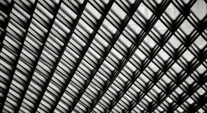 Black and white geometric pattern of modern architectural ceiling structure.