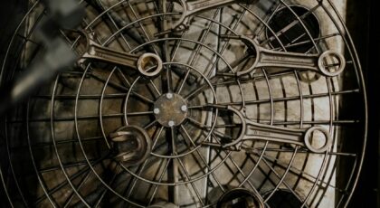 Top view of metal wrenches arranged on a grid in an industrial setting.