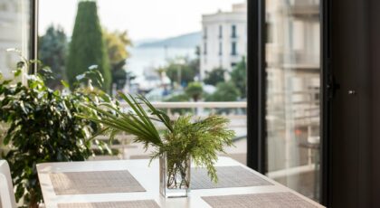 Elegant dining space with decor and view of Kavala's architecture.