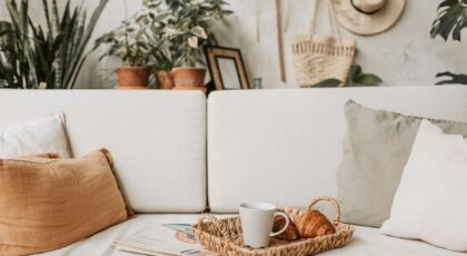 Cozy living room scene with coffee and croissants. Ideal for lifestyle and home decor concepts.