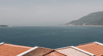 Charming villa in Antalya with red-tiled roofs and coastal views, embodying the Mediterranean essence.