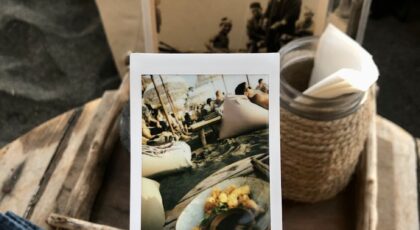 Sushi dining experience at a coastal café in Bali, Indonesia, showcasing exotic decor and lush surroundings.