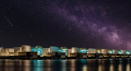 Coastal villas under a mesmerizing starry night sky with the Milky Way.