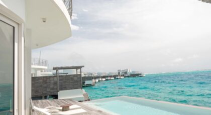 Modern beachfront villa in Maldives with stunning ocean views.