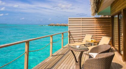 Peaceful overwater bungalow with ocean view, perfect for a tropical getaway.