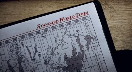 Close-up view of a world time zone map printed on paper inside a diary.