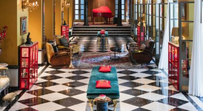 Luxurious hotel lobby in Bikaner, Rajasthan featuring chic interiors and a grand piano.