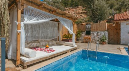 Enjoy a serene retreat with a luxury cabana by the pool at a Mediterranean villa.